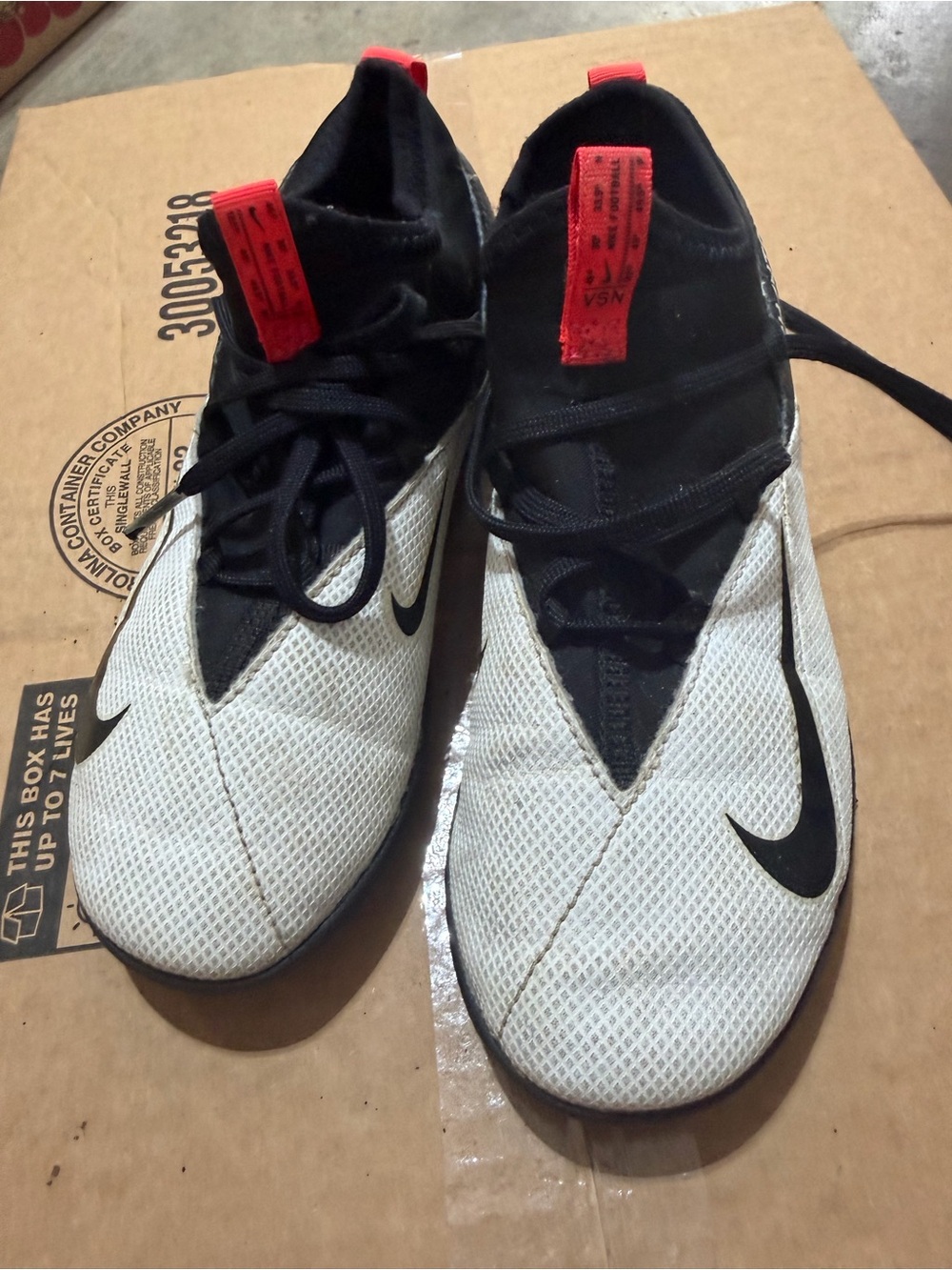 Nike Youth White and Black Athletic Trainers with Red Pull Tabs